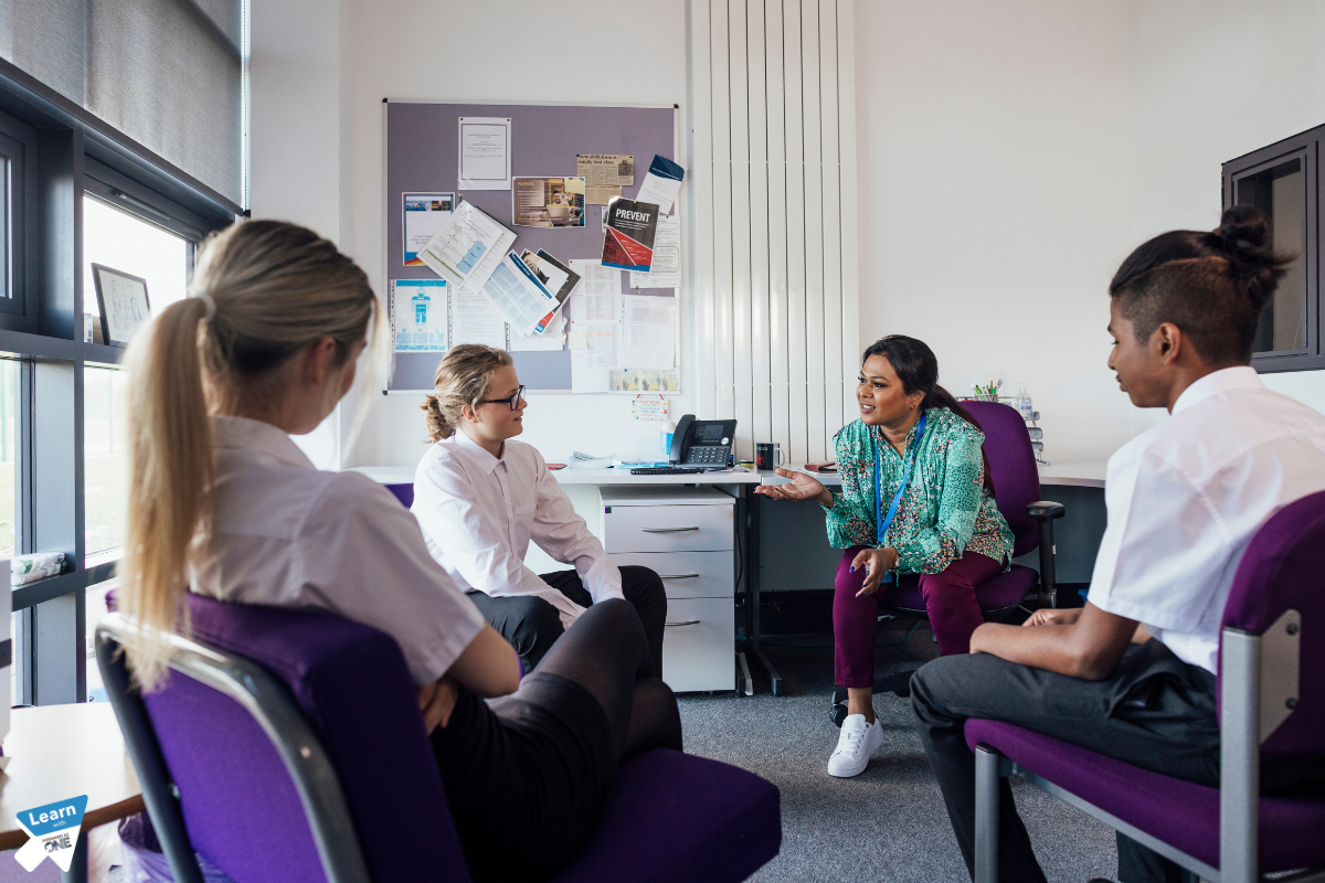 Teacher mentoring 3 pupils