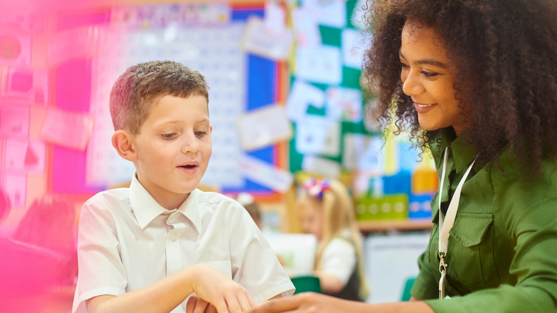 Female teacher with Primary school child
